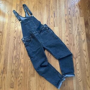 Women’s Levi Black denim overalls with a relaxed fit size Large